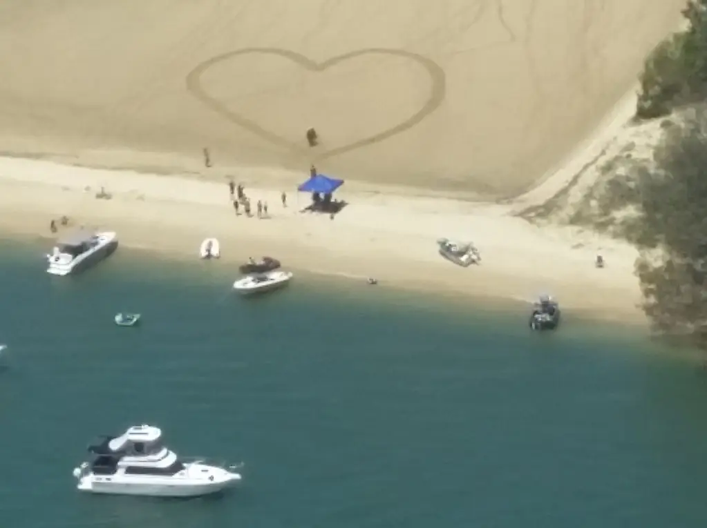 love heart on beach, locates a marriage proposal from the sky