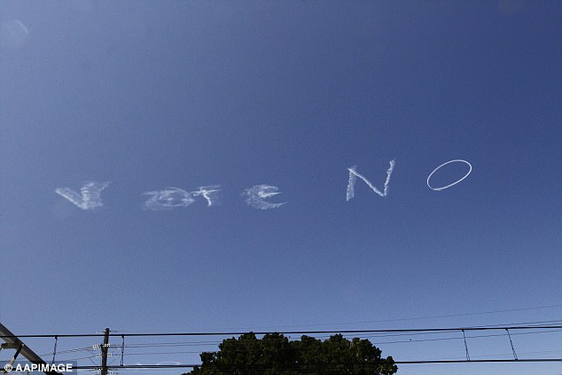 Smoke-skywriting. Vote No, is just readable. Mainly smudged