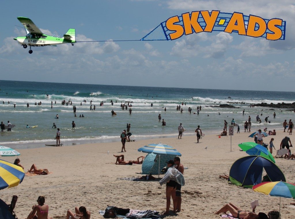 Crowded Beach audience looking up at SKY-ADS aerial display