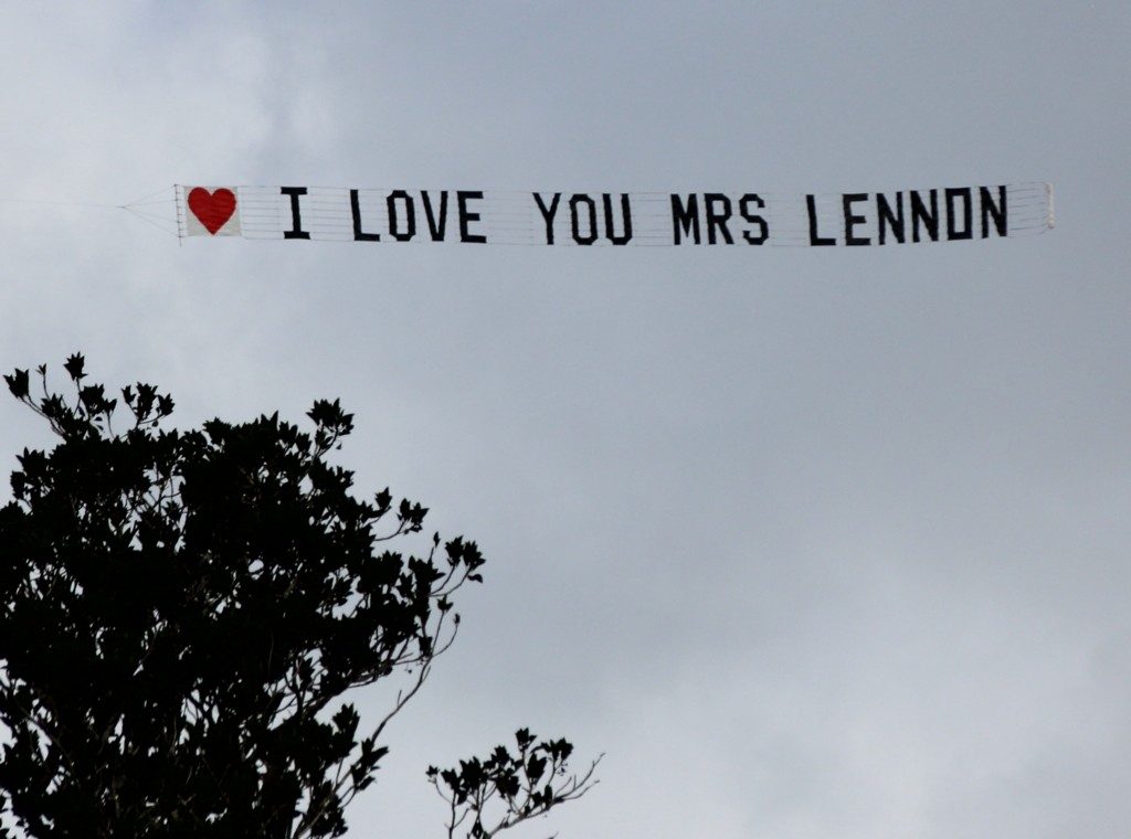 love you message flying over tree on a cloudy day
