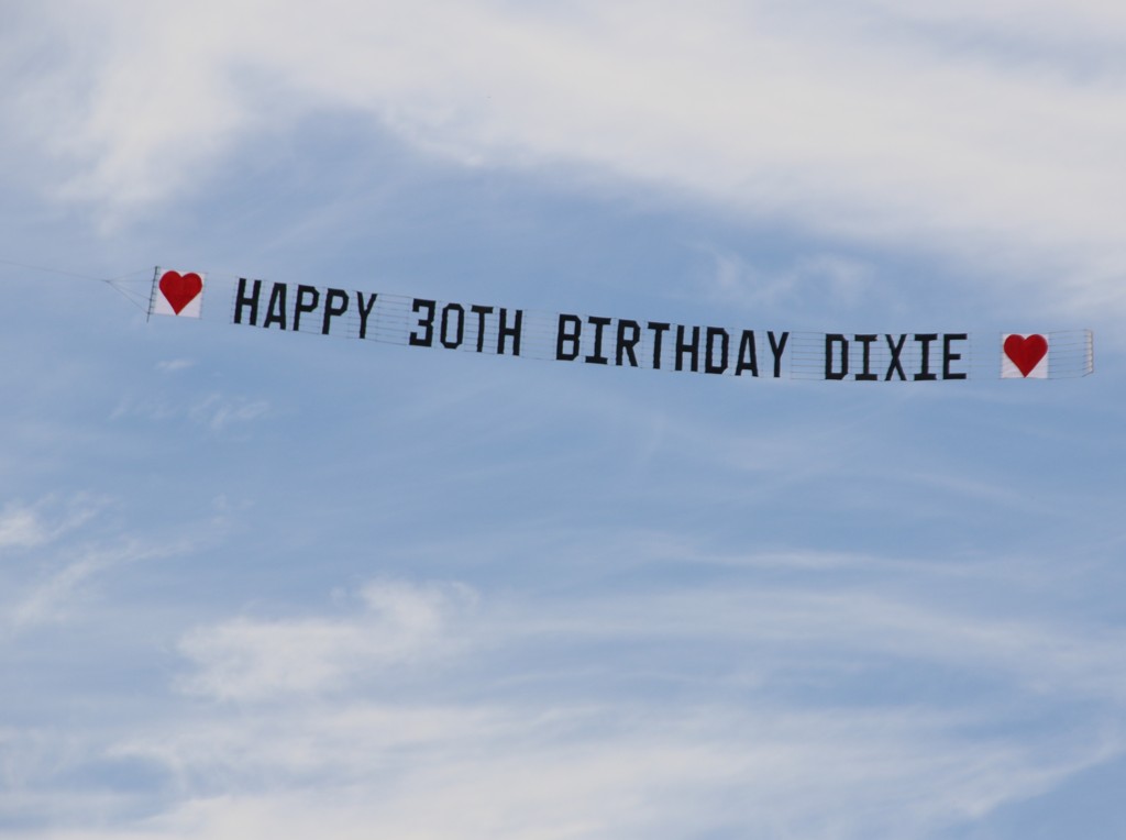 Sky Banner with Love Heart front and rear reads "Happy 30th Birthday Dixie"