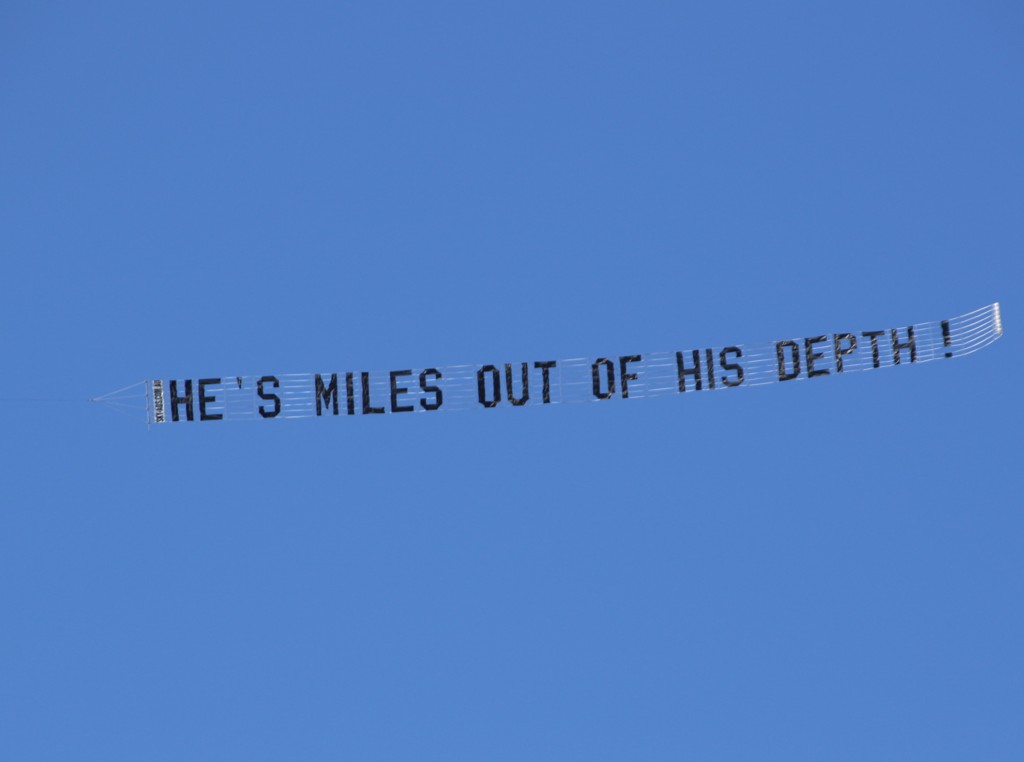 Protest Aircraft reads "He's Miles out of his depth