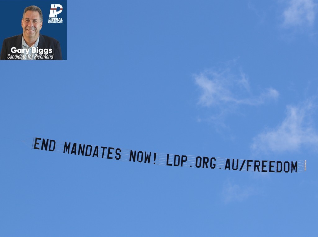 Sky sign reads "End Mandates Now! ldp.org.au"