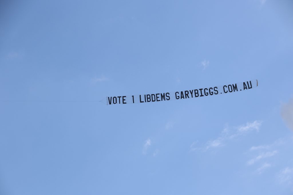 Sign in the air reads "Vote 1 Lib Dems - Gary Biggs