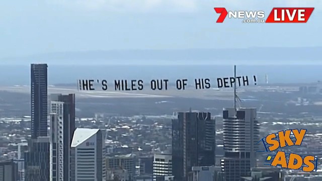 TV shot of Protest aeroplane over the Brisbane City