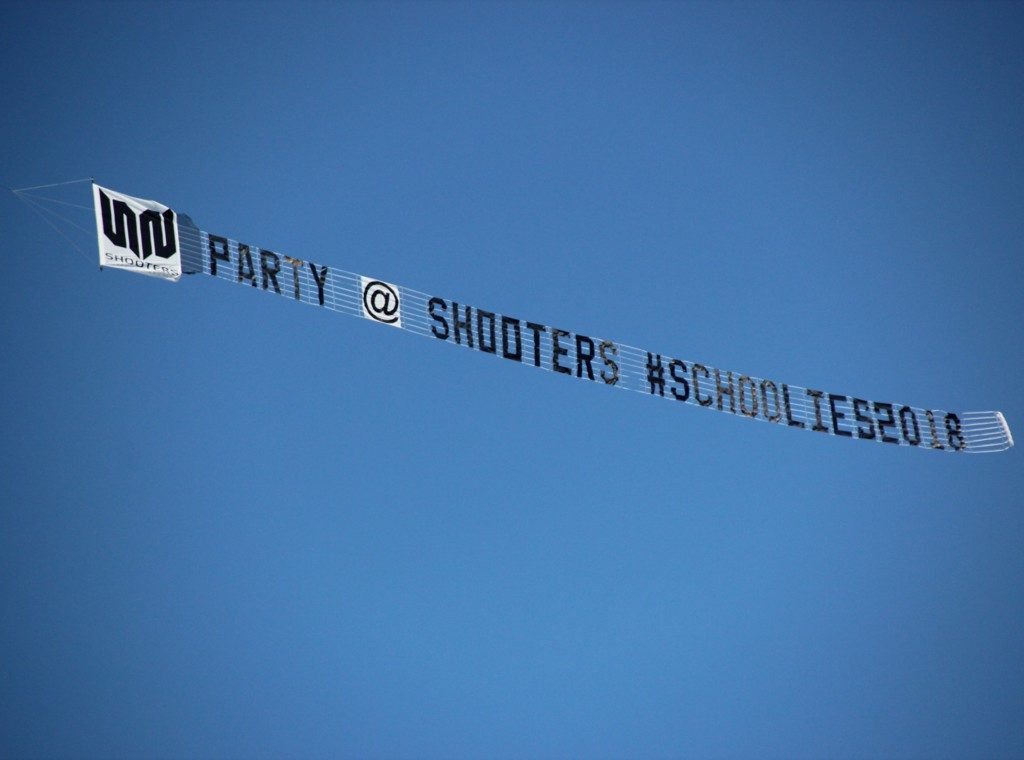 shooters schoolies sky sign. with shooters logo at the front of the banner